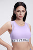 Purple sports bra with side mesh panels and a mesh racerback, featuring the TITIKA brand logo on the band.